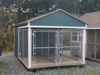 Pine Creek 8x14 Double Dog Kennel with Hunter Green walls, Navajo White trim, and Barkwood shingles